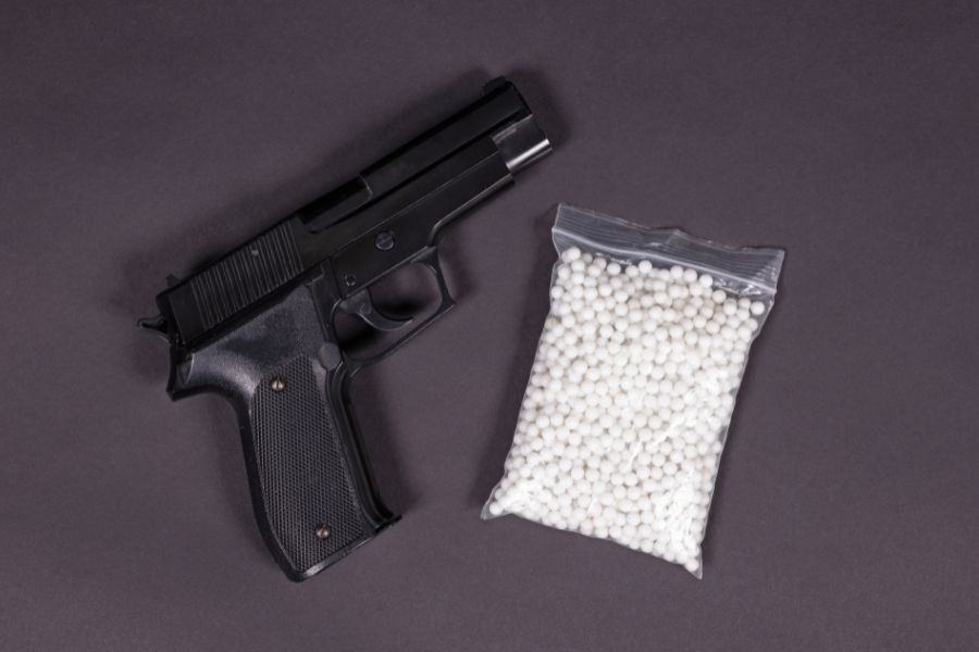 An airsoft gun with pellets