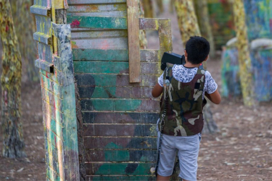 Playing laser tag outside in daytime