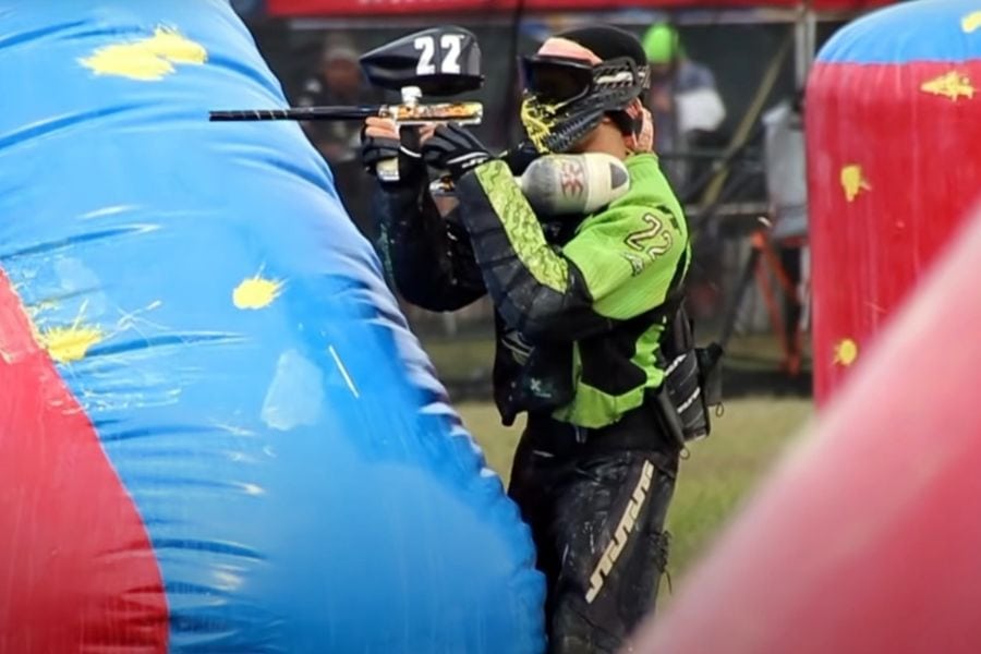 Playing with paintball gun in an arena
