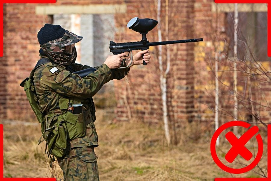 Holding and aiming paintball gun away from the body creates imbalance, resulting in low accuracy